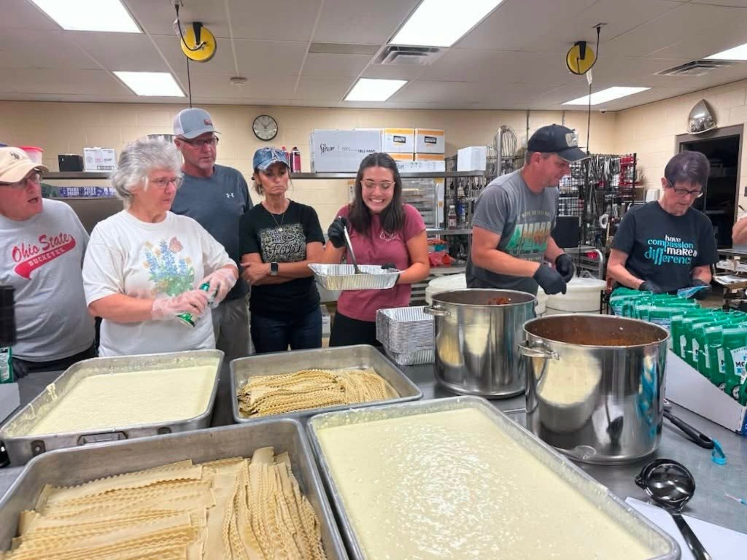 LoveZagna volunteers preparing meals during a bake day