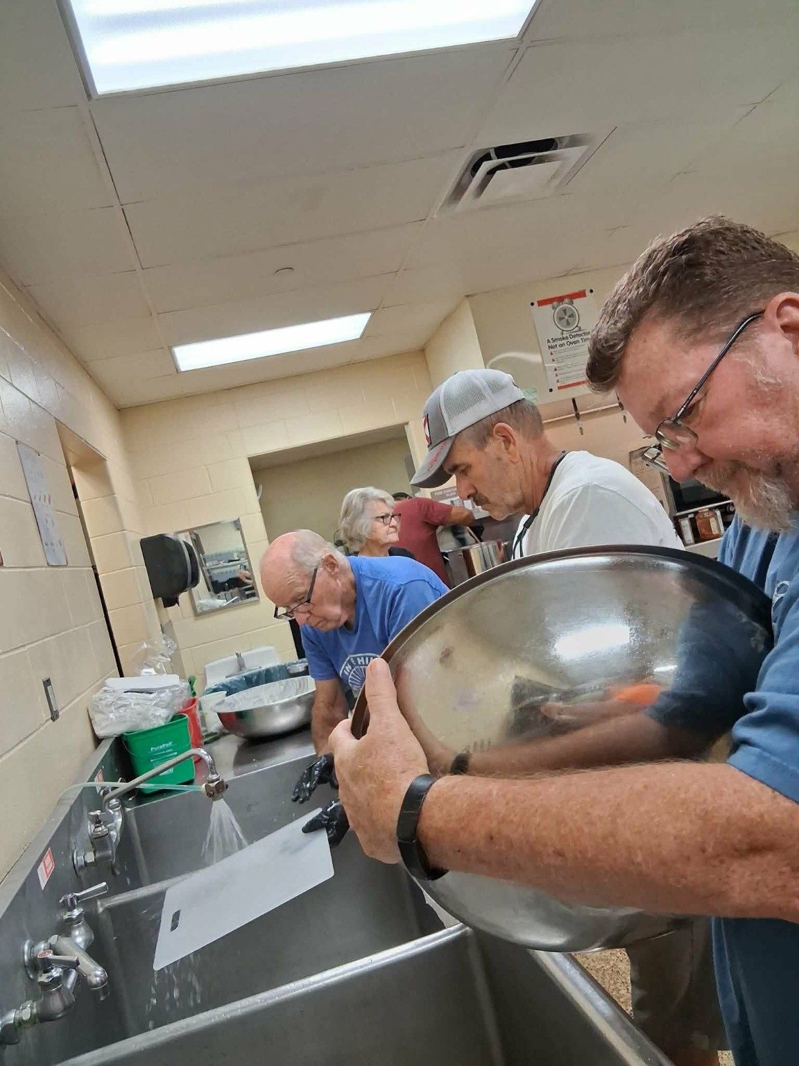 LoveZagna volunteers working throughout the kitchen