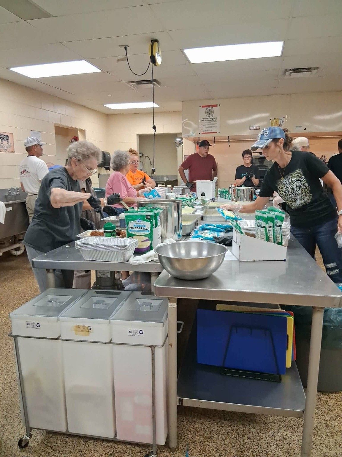 A LoveZagna volunteer team working around the kitchen