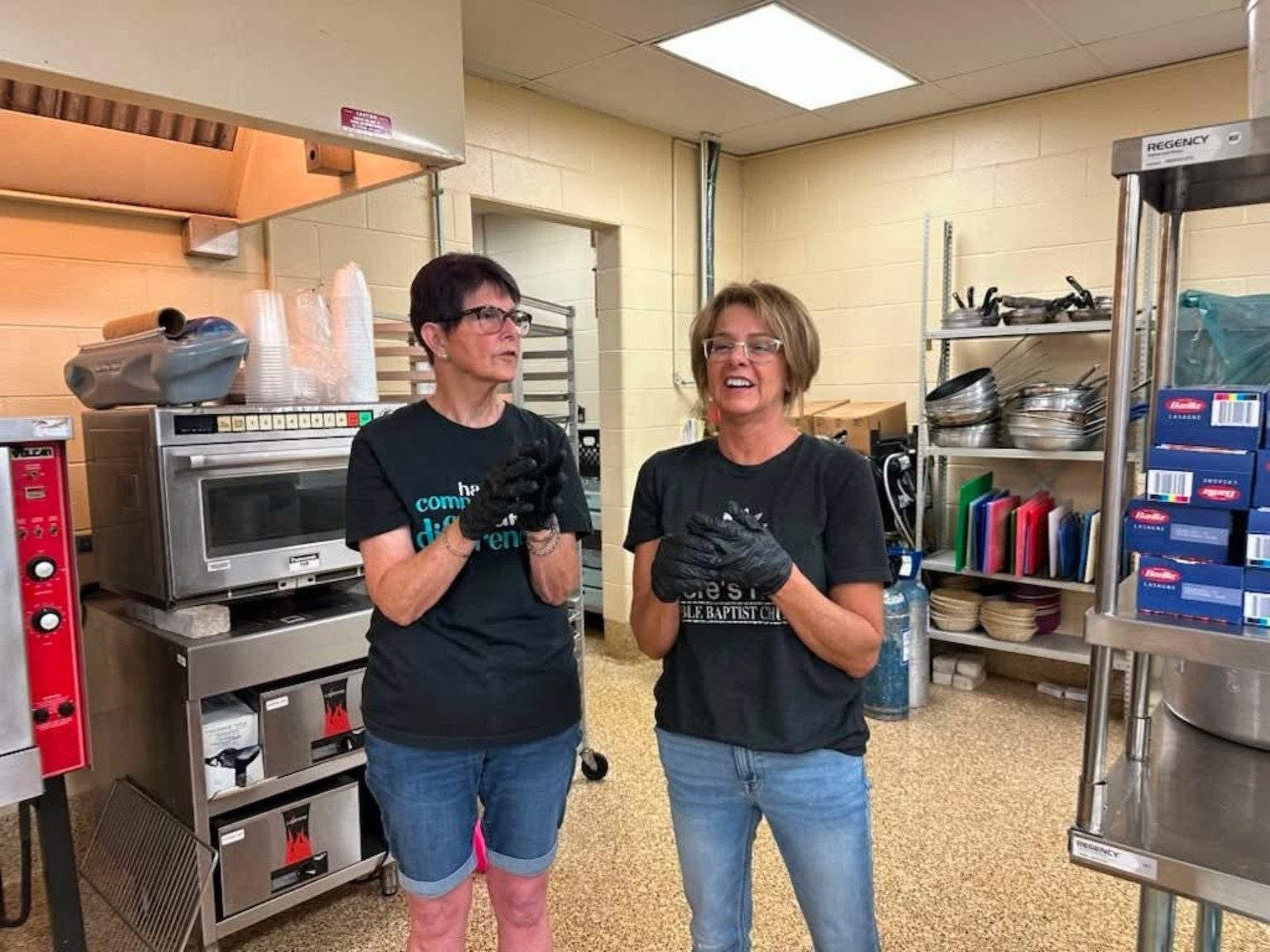 LoveZagna volunteers serving together in the kitchen